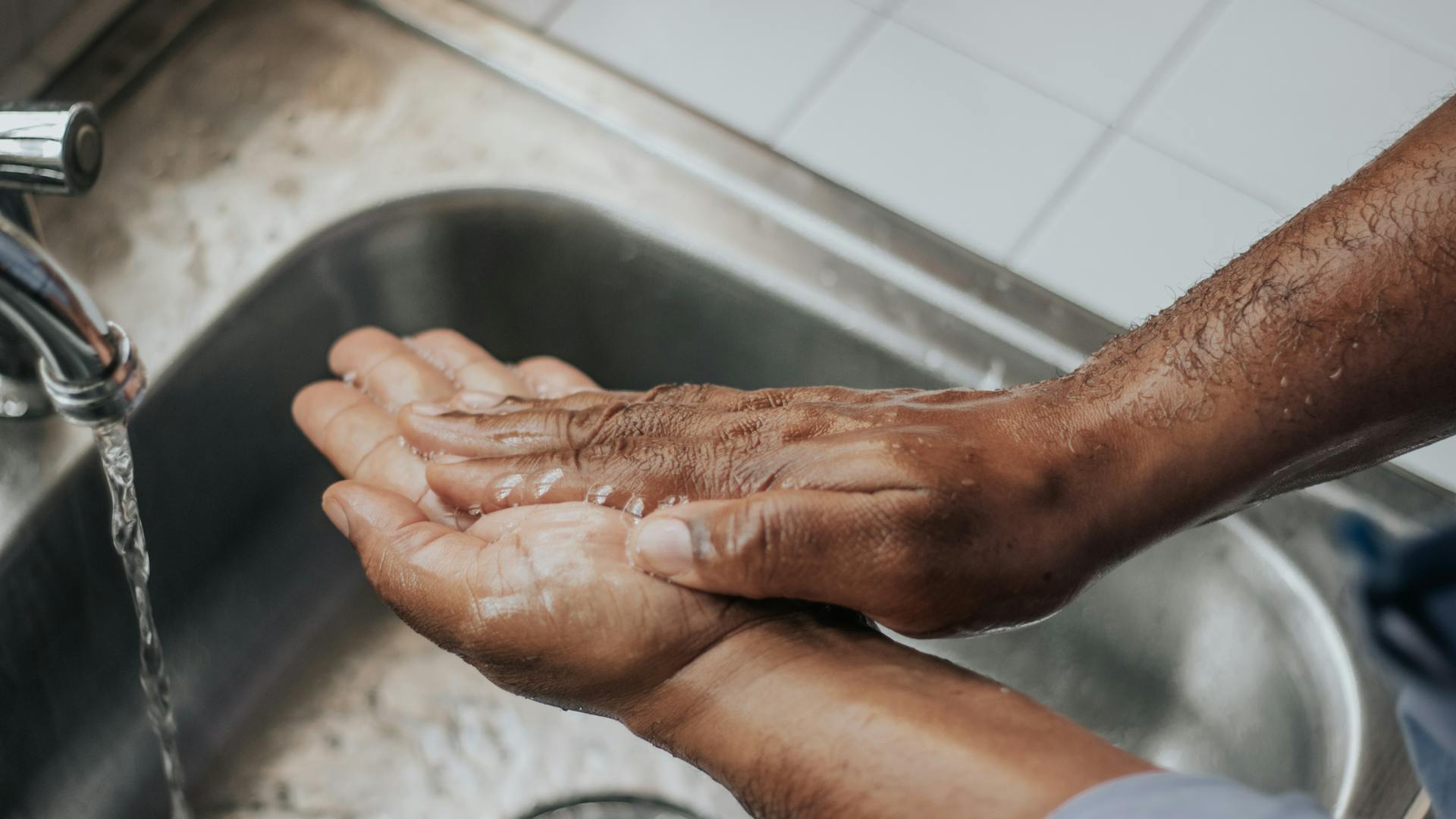 Washing hands, hot water
