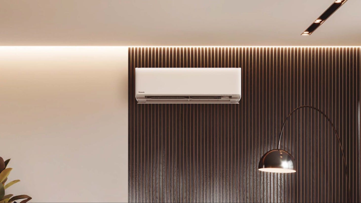 A white Panasonic HZ series heat pump hanging in the middle of a wall in a modern home.